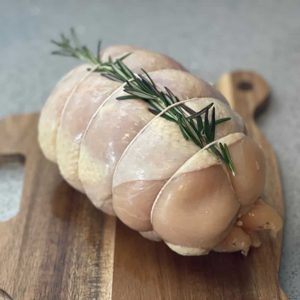 stuffed capon roast with rosemary and butcher twine